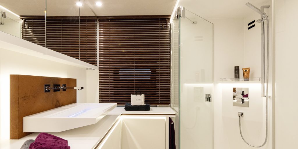 Rectangular design washbasin and XXL shower panel in mobile home